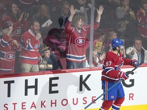 Canadiens captain Max Pacioretty celebrates along with fans after scoring on Boston Bruins goaltender Tuukka Rask during NHL game at the Bell Centre in Montreal on Jan. 20, 2018.