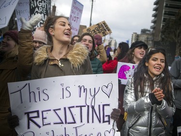 Alpha Pi Phi Sorority Alpha Chapter members Mikayla Cassack, left, and Dani Ochoa shout chants as the group walks along Bronson Avenue.