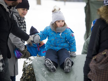 Three-year-old Khloe Bedard really thought about the slide before she took her turn. Members of the Governor General’s Foot Guards set up an obstacle course and demonstrated how a military camp is set up for winter.