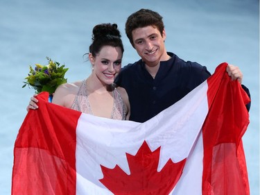 SOCHI: FEBRUARY 17, 2014 -- Tessa Virtue and Scott Moir of Canada celebrate their silver medal performance in the Ice Dance Free Dance figure skating event during the Sochi 2014 Olympic Games, February 17, 2014.