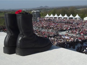 A pair of boots overlooks the thousands gathered at the Vimy Ridge monument to commemorate the 100th anniversary of the Battle of Vimy Ridge near Arras, France on April 9, 2017.
