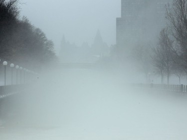 11:49 am. An iconic view up Rideau Canal towards the Chateau Laurier hotel is almost obliterated because of fog as the warm air temperature mixed with the cold ice and water on the canal. Ottawa was hit with some weird weather Friday, with balmy temperatures and rainy weather earlier in the day, giving way to cold, wind and snow later in the day. Julie Oliver/Postmedia