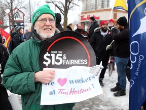 Don Smith was one of about 20 people who showed up in protest to supportof the Tim Hortons' employees at the Tim Hortons on Montreal Rd in Ottawa, January 19, 2018.