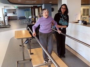 Mary Lacroix (L) does her physiotherapy exercise with physiotherapist Shiva Izady at the new Bruyère geriatric day hospital in Ottawa, January 24, 2018.
