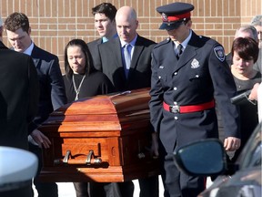 Pallbearers carry out the casket to the waiting hearse following Nick Hickey's funeral. The funeral was held Thursday (Jan. 25, 2018) at St. Martin de Porres Church in Nepean.