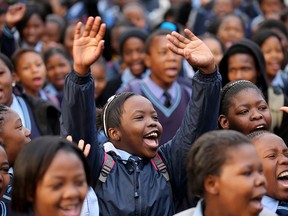 Schoolchildren sing 'Happy Birthday' to former South African President Nelson Mandela at Phefeni High School, opposite Mandela's former home in Soweto Township on July 18, 2013 in Johannesburg, South Africa.