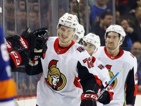 Thomas Chabot celebrates his first NHL goal with Senators teammates in a game against the Islanders on Dec. 1.