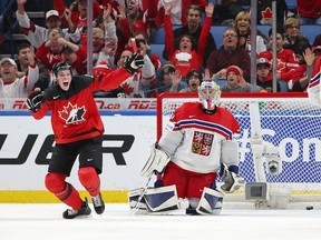 BUFFALO, NY - JANUARY 4: Drake Batherson #19 of Canada celebrates his second goal against Josef Korenar #30 of Czech Republic in the second period during the IIHF World Junior Championship