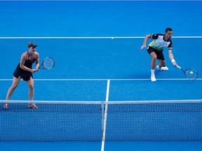 Gabriela Dabrowski of Canada and Mate Pavic of Croatia compete in their mixed doubles quarter-final match against Johanna Larsson of Sweden and Matwe Middelkoop of the Netherlands on day 11 of the 2018 Australian Open at Melbourne Park on January 25, 2018 in Melbourne, Australia.