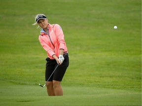 Brooke Henderson of Smiths Falls hits her second shot on the fifth hole during the first round of the Pure Silk Bahamas LPGA Classic on Thursday. She was leading by one stroke when play was suspended by darkness.