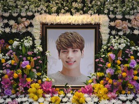 A portrait of Kim Jong-Hyun, a 27-year-old lead singer of the massively popular K-pop boyband SHINee, is seen on a mourning altar at a hospital in Seoul on December 19, 2017. The top K-pop star bemoaned feeling "broken from inside" and "engulfed" by depression in a suicide note. His death on Dec. 19, 2017 sent shockwaves across K-pop fans worldwide.