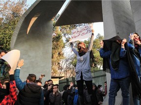 Iranian students protest at the University of Tehran during a demonstration driven by anger over economic problems, in the capital Tehran on December 30, 2017. Students protested in a third day of demonstrations sparked by anger over Iran's economic problems, videos on social media showed, but were outnumbered by counter-demonstrators.