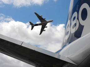 (FILES) This file photo taken on June 24, 2017 shows an  Airbus A380 performing a flying display at Le Bourget airport, near Paris during the public days the International Paris Air Show. European aerospace giant Airbus overtook arch-rival Boeing in terms of aircraft orders last year, but warned on January 15, 2018 that it could cease making its A380 jet if it does not receive any more orders for the supersize plane.