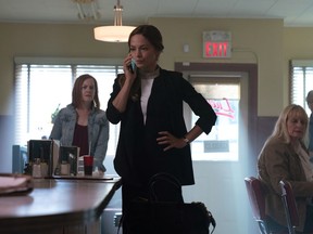 Kristin Kreuk (centre) in a scene from the new CBC drama  "Burden of Truth."