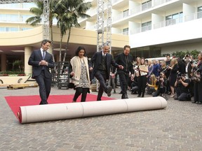 Seth Meyers, from left, Meher Tatna, Allen Shapiro and Barry Adelman roll out the red carpet at the 75th Annual Golden Globe Awards Preview Day at The Beverly Hilton on Thursday, Jan. 4, 2018, in Beverly Hills, Calif.