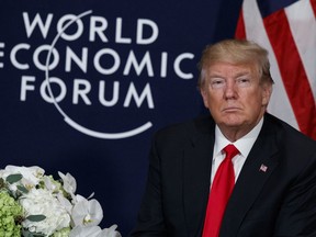 U.S. President Donald Trump listens during a meeting with Rwandan President Paul Kagame at the World Economic Forum, Friday, Jan. 26, 2018, in Davos, Switzerland.