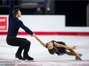 Eric Radford and Meagan Duhamel perform their short program during the senior pairs competition at the Canadian Figure Skating Championships in Vancouver on Friday.