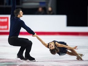 Eric Radford, left, and Meagan Duhamel perform their short program during the senior pairs competition at the Canadian figure skating championships in Vancouver on Friday Jan. 12, 2018.