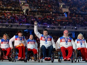 In this March 16, 2014 file photo, Russia's delegation is shown at the closing ceremony of the Sochi Paralympics.