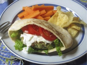 Spinach and feta burger with a cucumber yogurt sauce . This dish is from a recipe by Sara Moulton