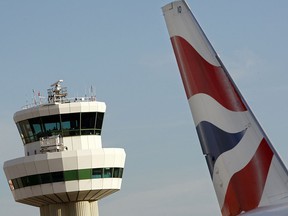 A tailfin of a British Airways jet pictured in front of the control tower at Gatwick airport is seen in a file photo.