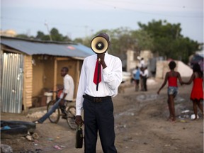 A man addresses the public in Haiti.