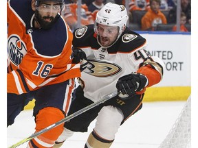 Anaheim Ducks' Logan Shaw (48) chases Edmonton Oilers' Jujhar Khaira (16) during second period NHL action in Edmonton, Alta., on Thursday January 4, 2018.