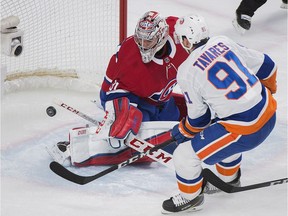 New York Islanders centre John Tavares (91) scores against Montreal Canadiens goaltender Carey Price (31) during second period NHL hockey action in Montreal, Monday, January 15, 2018.