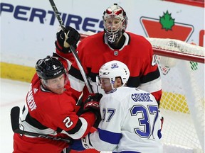Tampa Bay centre Yanni Gourde (37) tangles with Ottawa defenceman Dion Phaneuf (2) in front of goaltender Craig Anderson in the thired period of play at Canadian Tire Centre.