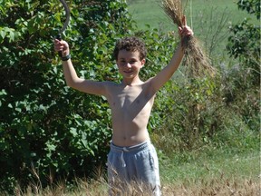 Steve Maxwell’s son Jacob harvesting some wheat he planted by hand to see where bread came from, experiencing some good old fashioned manual labour in the process.