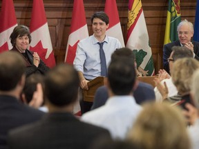 Prime Minister Justin Trudeau receives a standing ovation from caucus members as he speaks at the Liberal National Caucus Meeting on Parliament Hill in Ottawa on Sunday, Jan. 28, 2018.