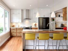 The renovated kitchen is open-concept, modern and takes advantage of natural light. It is now one of the family's favourite rooms in the house.