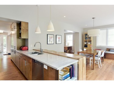 The renovated kitchen is open-concept, modern and takes advantage of natural light. It is now one of the family's favourite rooms in the house.