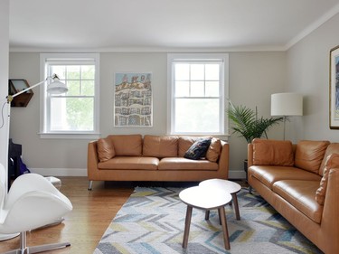 The existing living room was maintained during the renovation process but now has a modern feel with natural light making it bright and comfortable.