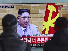 South Koreans watch a TV news program showing North Korean leader Kim Jong Un's New Year's speech, at the Seoul Railway Station in Seoul, South Korea, Monday, Jan. 1, 2018. The letters read on top left, "Kim Jong Un delivers New Year's speech." Kim said Monday the United States should be aware that his country's nuclear forces are now a reality, not a threat. But he also struck a conciliatory tone in his New Year's address, wishing success for the Winter Olympics set to begin in the South in February and suggesting the North may send a delegation to participate.