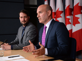 NDP MP Nathan Cullen, right, speaks about electoral reform at a press conference last May with MP Alexandre Boulerice.