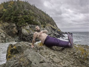 William Whelan is shown in this undated handout image at Beach Cove in Portugal Cove, N.L. near St. John's for the 2018 Merb'ys calendar. A calendar of bearded, mermaid-tailed Newfoundlanders has raised hundreds of thousands of dollars for mental health.