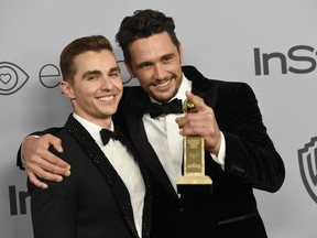 FILE - In this Jan. 7, 2018, file photo, Dave Franco, left, poses with James Franco, winner of the award for best performance by an actor in a motion picture - musical or comedy for "The Disaster Artist," at the InStyle and Warner Bros. Golden Globes afterparty in Beverly Hills, Calif. The New York Times has canceled a public event with James Franco days after the Golden Globe winner was accused of sexual misconduct. The TimesTalk event scheduled for Wednesday, Jan. 10, was intended to feature "The Disaster Artist" director and star and his brother and co-star, Dave Franco, discussing the film with a Times reporter. The Times said in a statement that "given the controversy surrounding recent allegations" it was canceling the event.