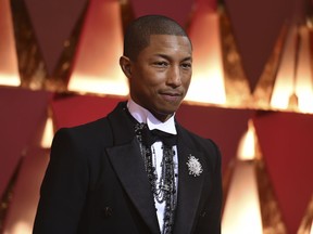 FILE - In this Feb. 26, 2017, file photo, Pharrell Williams arrives at the Oscars at the Dolby Theatre in Los Angeles. The NBA announced Thursday, Jan. 18, 2018, that 11-time Grammy winner Pharrell and his hip hop-rock band N.E.R.D. will headline the halftime show at the 2018 NBA All-Star game in Los Angeles next month.