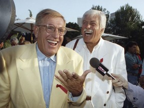 FILE - In this Aug. 25, 1992 file photo, Jerry Van Dyke, left, and his brother, Dick, laugh during a party in Los Angeles. Manager said Saturday, Jan. 6, 2018, that Jerry Van Dyke, 'Coach' star and younger brother of comedian Dick Van Dyke, has died in Arkansas at 86. Manager, John Castonia, said Van Dyke died Friday at his ranch in Hot Spring County. His wife, Shirley Ann Jones, was by his side.
