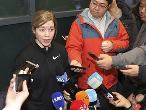 In this Tuesday, Jan. 16, 2018, photo, South Korean women's hockey team head coach Sarah Murray speaks as she returns from the team's U.S. training camp, at Incehon International Airport in Incheon, South Korea.