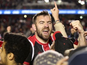 Fury FC defender Colin Falvey is swarmed by fans and teammates after Ottawa defeated Minnesota United FC in extra time to advance to the NASL Soccer Bowl final in 2015.