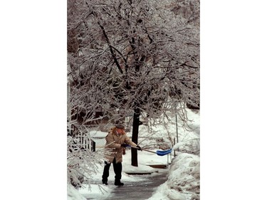 Ottawa 1998 Ice Storm - A man shovels the ice from his walkway.