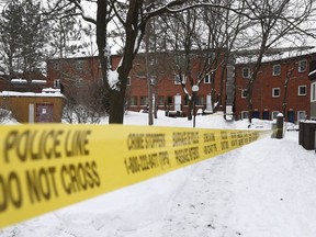 Police tape protects the scene after the shooting at a housing complex on Paul Anka Drive on Wednesday, Jan 10, 2018.
