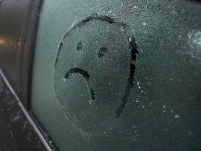 An ice covered car in Ottawa Thursday Jan 11, 2018. Ottawa received freezing rain over night causing school busses to be canceled.  Tony Caldwell