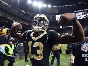 New Orleans Saints wide receiver Michael Thomas (13) reacts to fans after beating the Carolina Panthers in New Orleans, Sunday, Jan. 7, 2018.