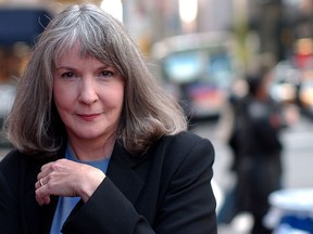 FILE - In this Oct. 15, 2002 file photo, mystery writer Sue Grafton poses for a portrait in New York. Grafton has died in Santa Barbara, Calif., at the age of 77. Her daughter, Jamie Clark says her mother passed away Thursday night, Dec. 28, 2017, after a two-year battle with cancer and was surrounded by family.