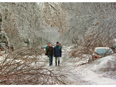 Twenty years ago, nearly five million Canadians in southeastern Quebec, eastern Ontario and parts of the Maritimes were battered by three successive waves of freezing rain between Jan. 5 and 10. Pedestrians make their way past downed trees as an ice storm ripped through Montreal Tuesday, January 6, 1998. The storm has left over 600,000 people without electricity as ice-covered trees crashed down on power lines.