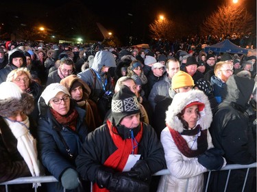 People attend a vigil to commemorate the one-year anniversary of the Quebec City mosque shooting, in Quebec City, Monday, Jan.29, 2018.