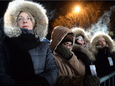 Participants observe a moment of silence during a vigil to commemorate the one-year anniversary of the Quebec City mosque shooting, in Quebec City, Monday, Jan.29, 2018.